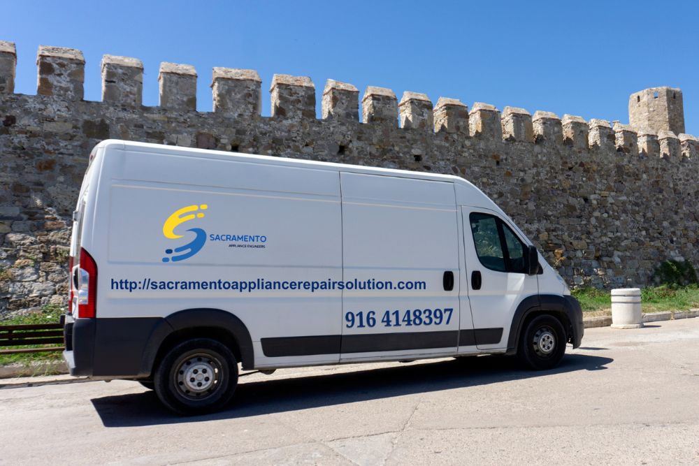 A service van parked by a castle wall, symbolizing appliance repair services available in Sacramento, CA.